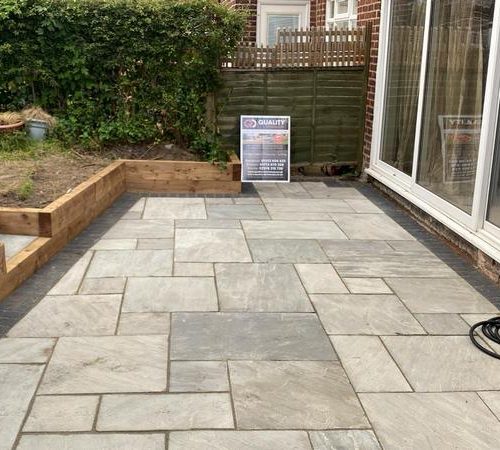 indian sandstone patio with wooden sleepers in blackpool 02