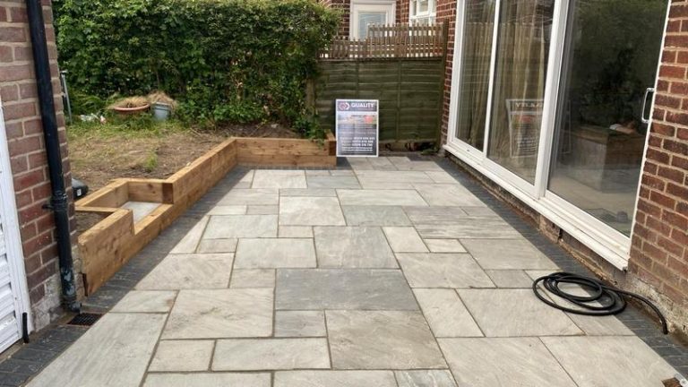 indian sandstone patio with wooden sleepers in blackpool 02